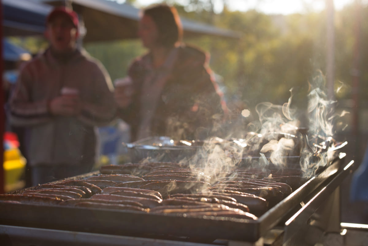 A group of people at a barbecue event