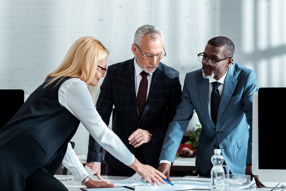 Business professionals reviewing documents