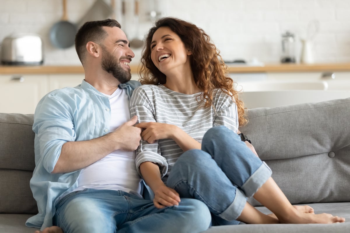 Happy tenants sitting on a couch