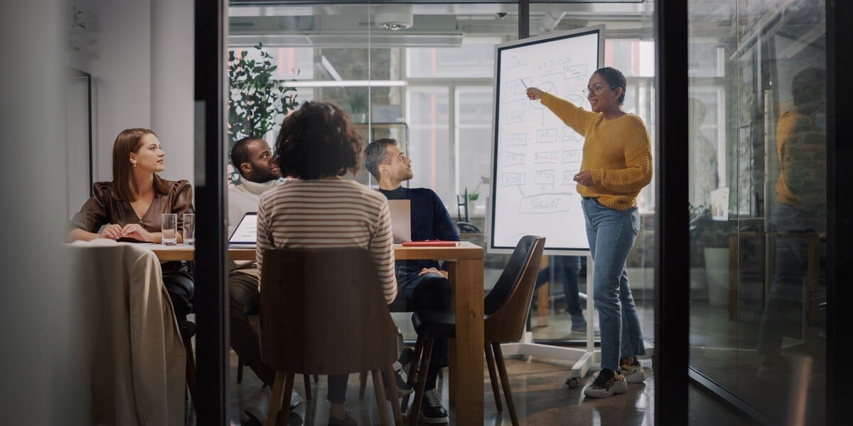 A woman giving a presentation of a marketing strategy